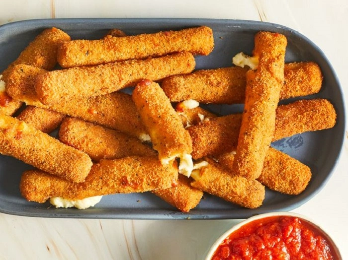Breading the Mozzarella Stickss